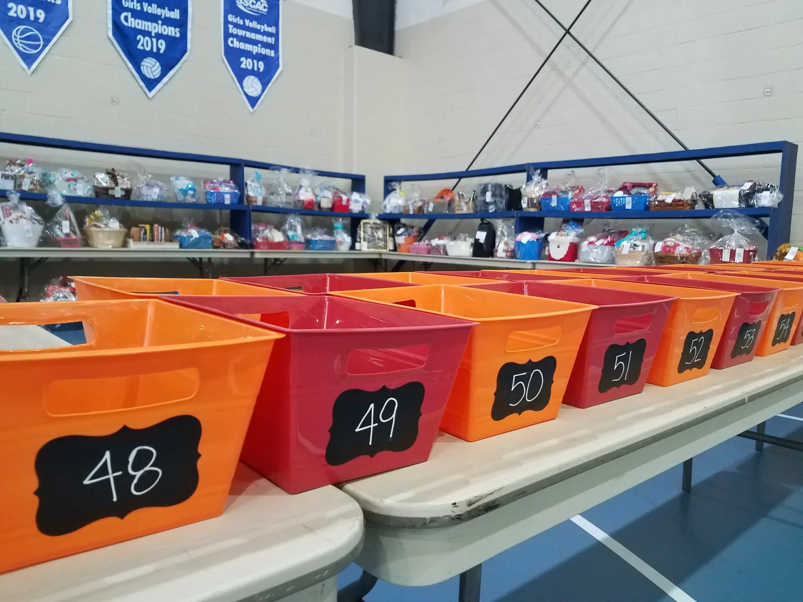 Numbered basket raffle bins and donated raffle baskets