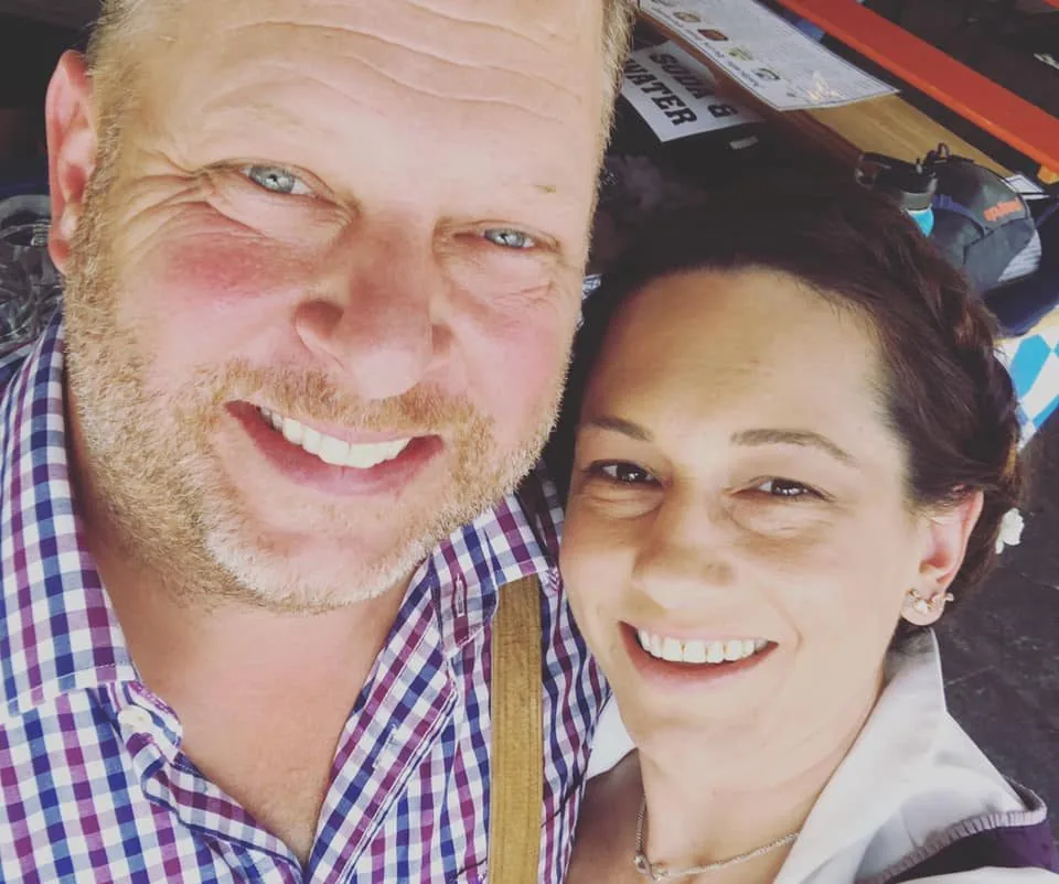 Beer sponsor representatives smiling at Oktoberfest