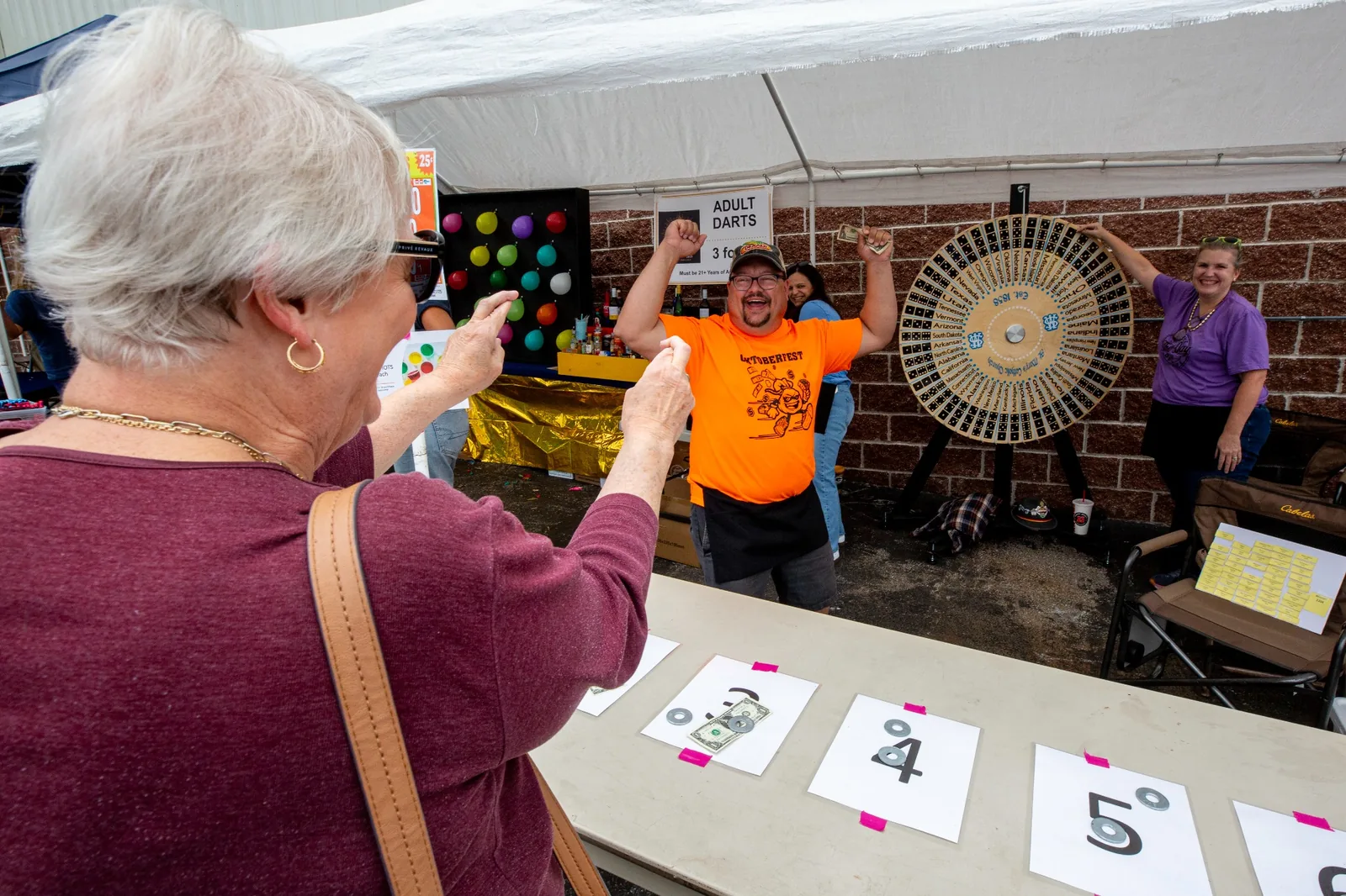 Adult games area with balloon darts and the 50 states wheel