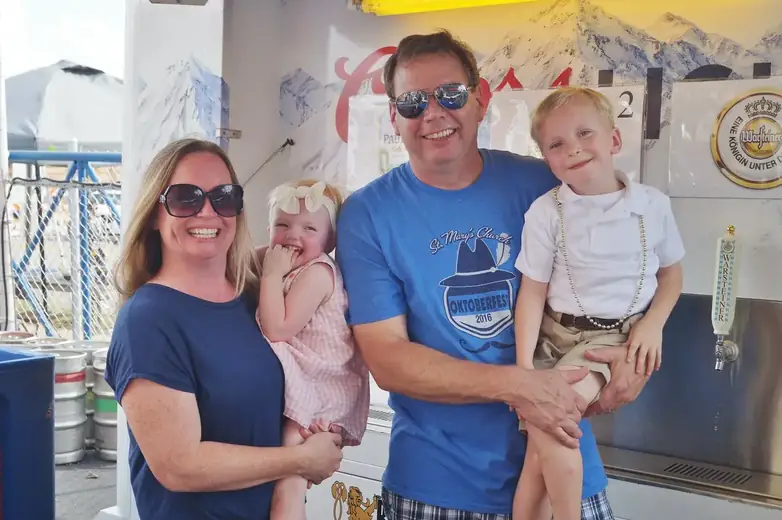 A parish family wearing St. Mary’s Oktoberfest sweatshirts