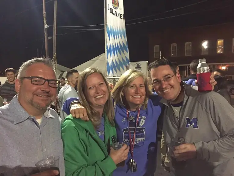 Parish friends and past event leaders smiling together at Oktoberfest
