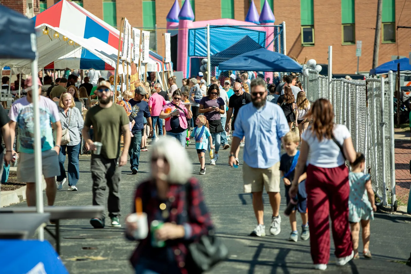 Guests walking through the Oktoberfest grounds