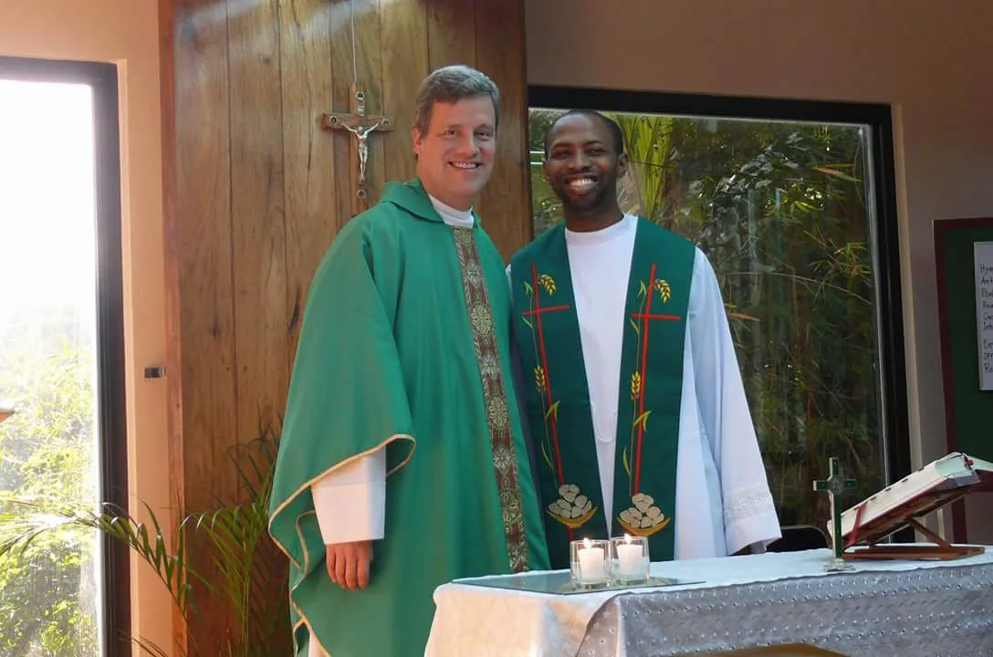 Priests standing near the altar
