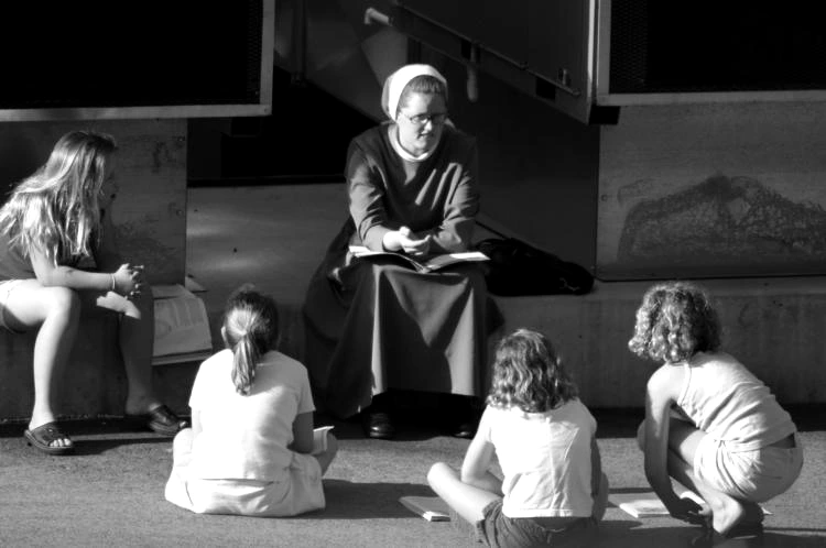 A sister teaching children in a historic St. Mary’s School classroom