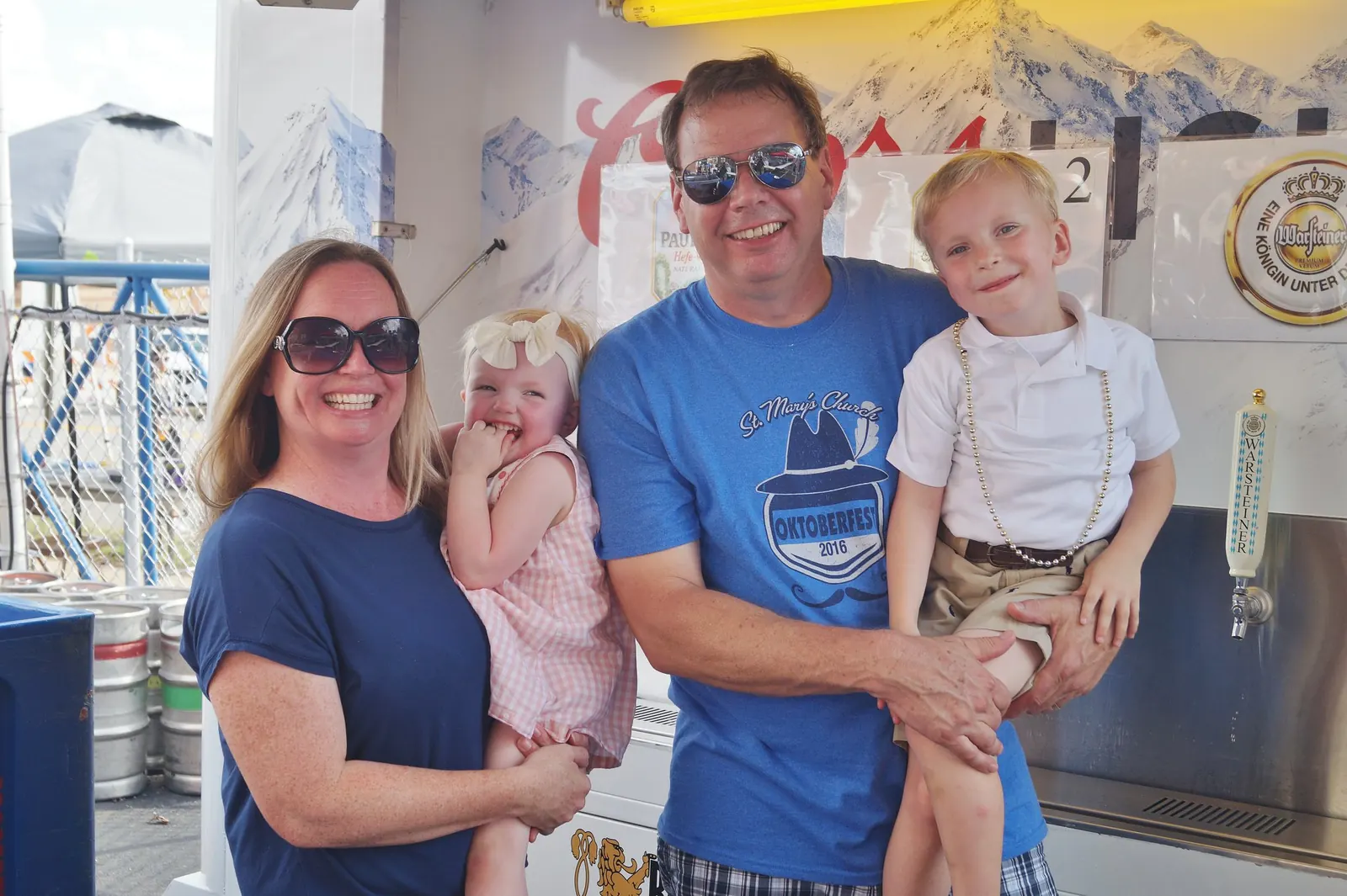 Family at the St. Mary’s Oktoberfest beer and food area